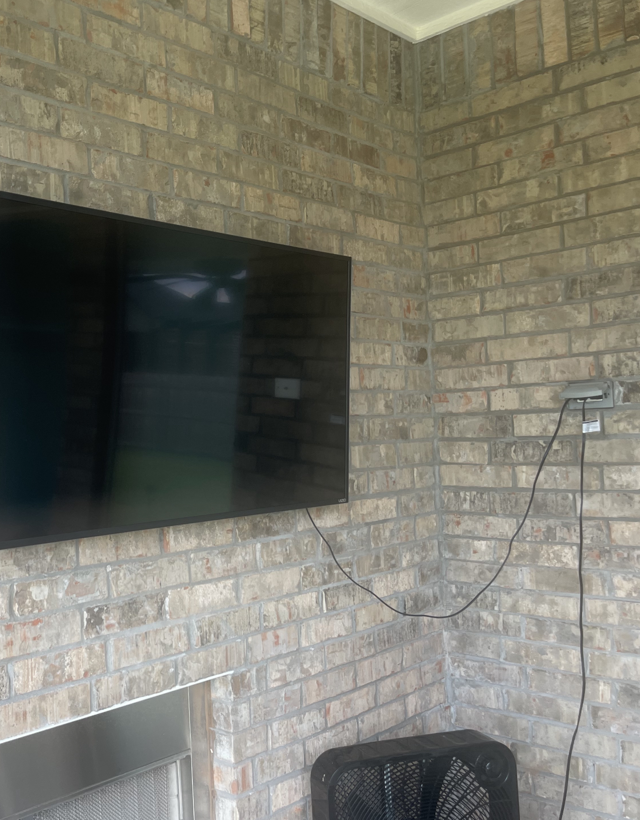 TV Mounting and Installing Services on a Brick Patio Wall in Edmond, OK